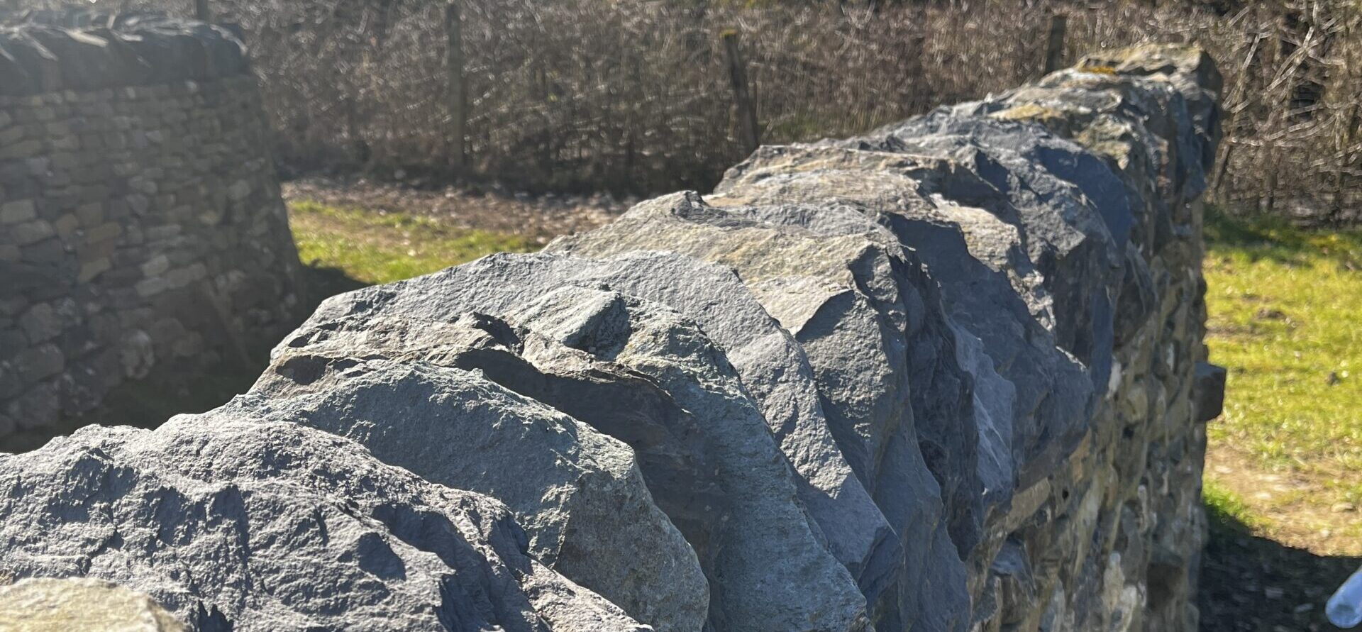 Dry stone wall built with Kirkby Moor slate as the coping stones